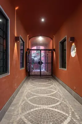 an empty hallway with a door with a stone floor at Orso Apartment in Rome