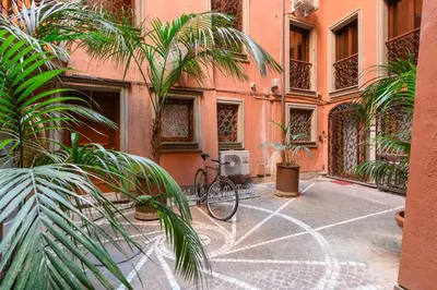 a bike parked in front of a building at Orso Apartment in Rome