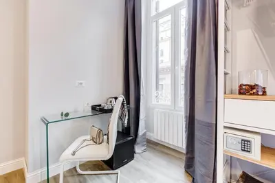 a dressing room with a glass table and a white chair at Opera Private Suites by Premium Suites Collection in Rome
