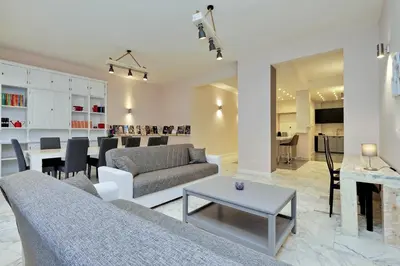 a living room with a couch and a table at TERRACED APARTMENT - Metro to Vatican & center in Rome