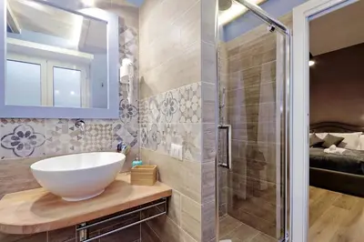 a bathroom with a sink and a shower at TERRACED APARTMENT - Metro to Vatican & center in Rome