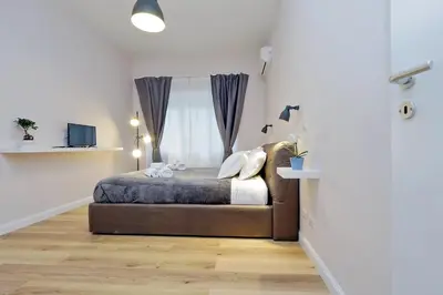 a bedroom with a bed and a window at TERRACED APARTMENT - Metro to Vatican & center in Rome