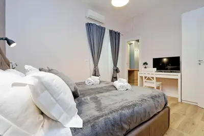 a bedroom with a bed with two towels on it at TERRACED APARTMENT - Metro to Vatican & center in Rome