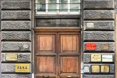 a wooden door on the side of a building at Hotel Paba in Rome