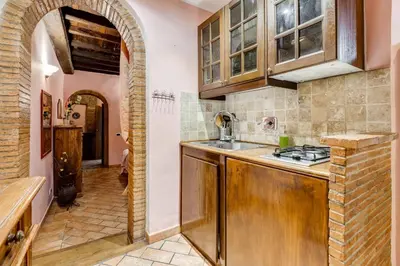 a kitchen with a sink and a stove at Colosseum Rione Monti 1 in Rome