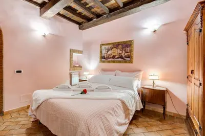 a bedroom with a large bed in a room at Colosseum Rione Monti 1 in Rome
