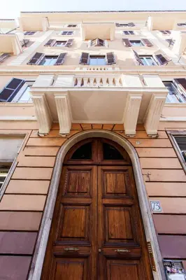 an entrance to a building with a wooden door at El Dorado Colosseum in Rome