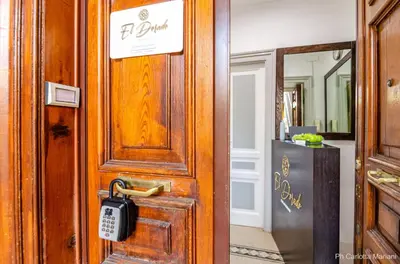 a wooden door with a padlock on it at El Dorado Colosseum in Rome