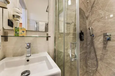 a bathroom with a sink and a shower at Seven in Rome