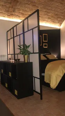 a bedroom with a bed and a dresser with a mirror at CasAphrodite in Rome