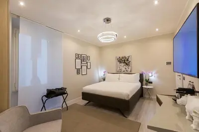 a bedroom with a bed and a couch at Clementi Portrait in Rome