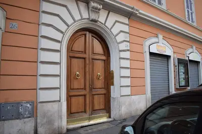 a wooden door on the side of a building at B&B Lost in Rome in Rome