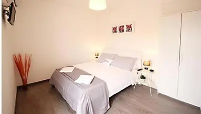a bedroom with a large white bed in a room at B&B Lost in Rome in Rome