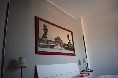 a picture on the wall of a room at B&B Lost in Rome in Rome