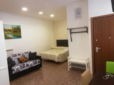 a room with a bed and a couch in it at Apartment Urbino 33 in Rome