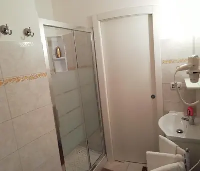 a bathroom with a shower and a sink at Apartment Urbino 33 in Rome