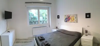 a small bedroom with a bed and a window at OASI METROPOLITANA Apartment in Rome