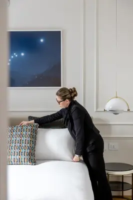 a woman standing on top of a couch at Parisii Luxury Relais Rome in Rome