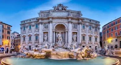a building with a fountain in front of it at Parisii Luxury Relais Rome in Rome