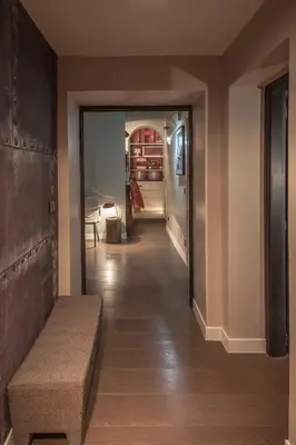 a hallway with a couch and a hallway with a room at Frattina 57 in Rome