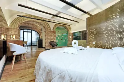 a bedroom with a large white bed in a room at Restart Accommodations Ada in Rome