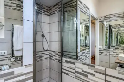 a bathroom with a shower and a sink at Maison Babuino in Rome