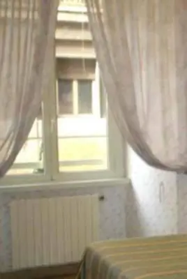 a bedroom with a window with curtains and a bed at Hotel Demetra Capitolina in Rome