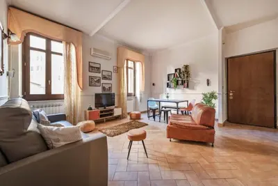 a living room with a couch and chairs and a table at Re Di Roma Vintage Apartment in Rome