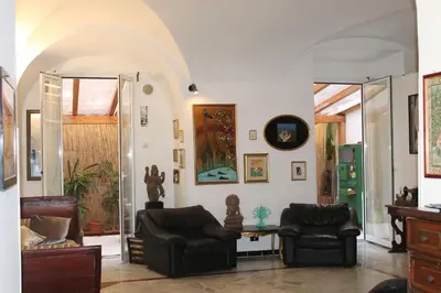 a living room with two chairs and a table at Elly's Loft in Rome