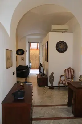 a living room with a couch and a table at Elly's Loft in Rome