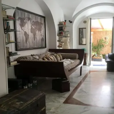 a living room with a couch in a room at Elly's Loft in Rome