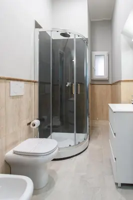 a bathroom with a toilet and a glass shower at GuestHouse o Affittacamere Magenta Baylon Suite B in Rome