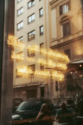 a window with a sign in front of a building at YellowSquare Rome in Rome