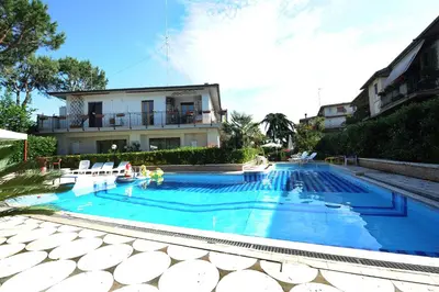 a large swimming pool in front of a house at Casa di Alberta in Rome