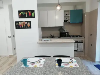 a kitchen with a table with two plates on it at Rita a Trastevere in Rome