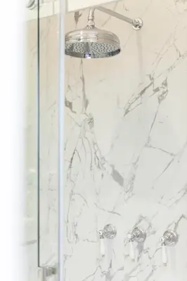 a bathroom with a shower with white marble at Vatican Suites - The Luxury Leading Accommodation in Rome in Rome