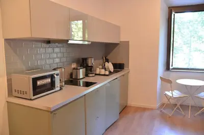 a kitchen with a counter top with a microwave at All You Need is Rome Guesthouse in Rome