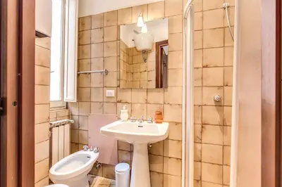 a small bathroom with a sink and a toilet at Finally in Rome in Rome