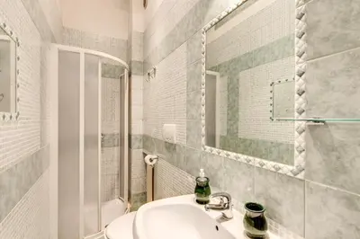 a bathroom with a sink and a mirror at Finally in Rome in Rome