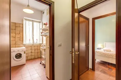 a bathroom with a door leading to a bedroom at Finally in Rome in Rome