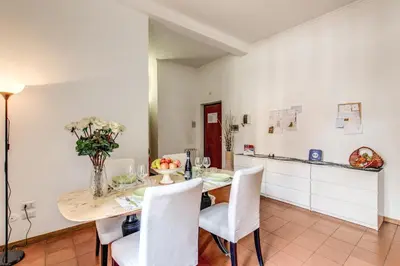 a kitchen and dining room with a table and chairs at Finally in Rome in Rome