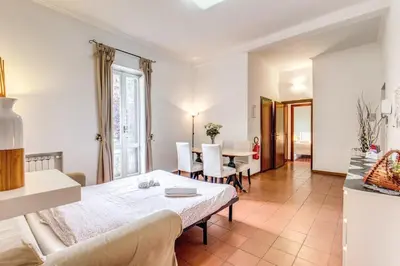 a room with a bed and a table and chairs at Finally in Rome in Rome