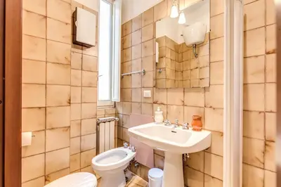a bathroom with a toilet and a sink at Finally in Rome in Rome