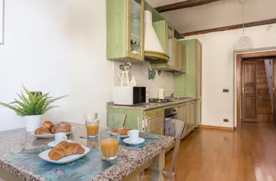 a kitchen with a table with food on it at Torripa Group - Trastevere in Rome