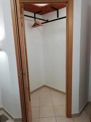 a closet with a glass door and a tile floor at Casa SereTina in Rome
