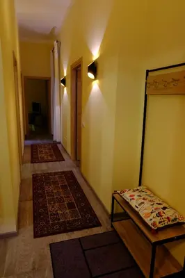 a hallway with two rugs and a bed in a room at Villa Ella in Rome