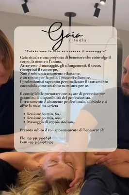 a person laying on a bed holding a sign at Villa Ella in Rome