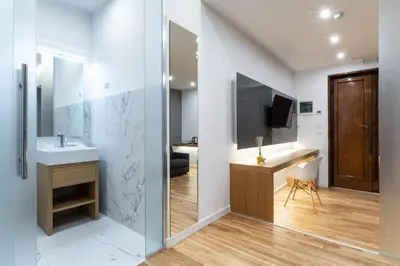 a bathroom with a sink and a mirror at Concept Terrace Hotel in Rome