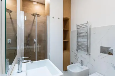 a bathroom with a shower and a sink and a toilet at Concept Terrace Hotel in Rome