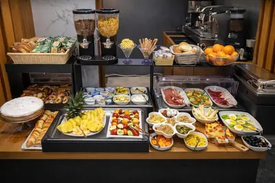 a buffet line with many different types of food at Concept Terrace Hotel in Rome